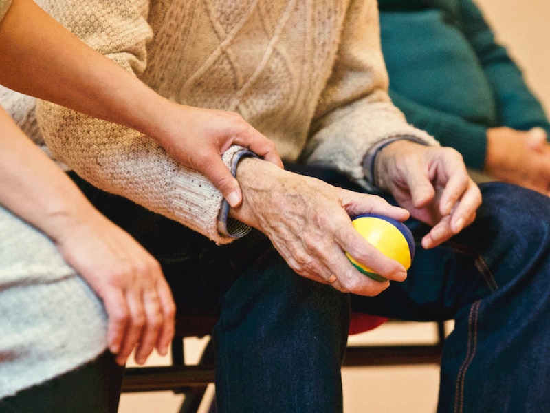 elderly holding stress ball