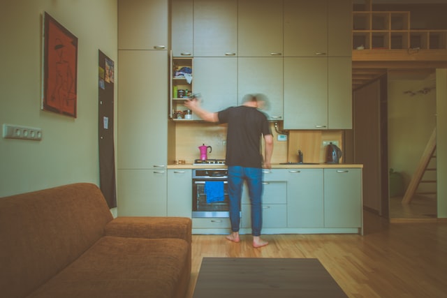 man with kitchenette