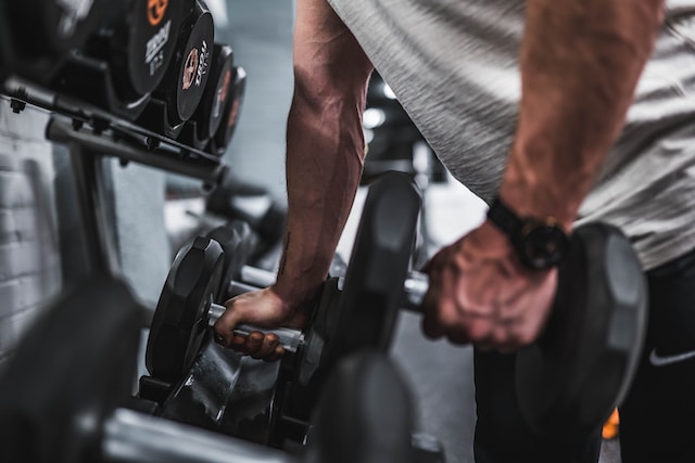 holding dumbbells