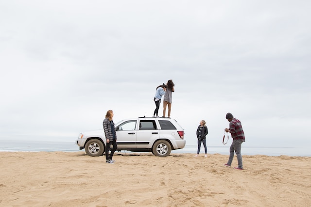 standing on jeep suv standing on jeep suv