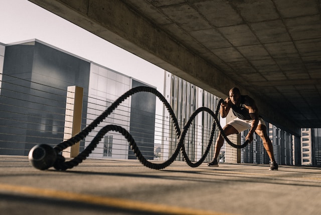 man exercising with rope
