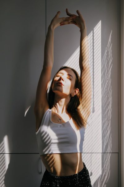 woman stretching hands up woman stretching hands up