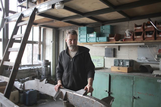 male mechanic in shabby workshop